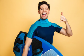 Canvas Print - Portrait of a happy young man dressed in swimsuit