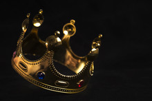 The Golden Crown Of The King On A Black Background In The Fall
