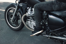 Mounted Black Vintage 1980s Custom Motorcycle On Pavement