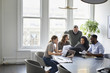 © Cavan Images - Business people discussing in meeting at office
