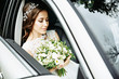 © matilda553 - Wedding Day: beautiful bride with bouquet of white flowers in the car
