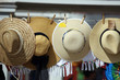 hats hanging on line for sale in market, St. Croix, U.S. Virgin Islands,Lesser Antilles, Caribbean