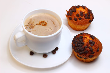 A cup of cappuccino and cupcakes on a white background