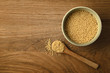 Couscous Bowl and Spoon from Above on Oak Wood Background