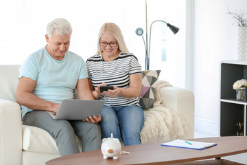 Sticker - Mature couple thinking over pension plan at home