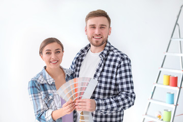 Sticker - Young couple with color palette on white background