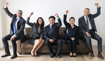 Business people sitting together on couch