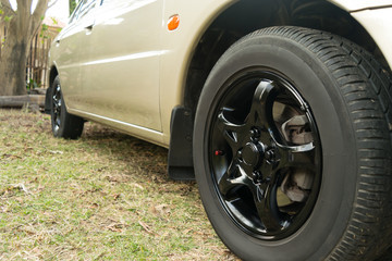 Black car wheel in retro style background