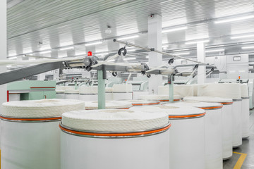 Wall Mural - Machinery and equipment in the workshop for the production of thread, overview. interior of industrial textile factory