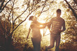 © Mladen - Smiling happy African American couple running and catching in park