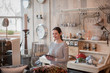 © ReeldealHD images - Portrait of small business owner holding digital tablet in a home store