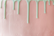 The Front Side Of The Pink Cake With Cream Drips. Copy Space