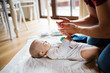 © Halfpoint - Father with a baby girl at home.