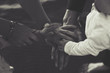 © antonburkhan - hands of all members of family