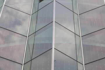 The glass wall on the building.