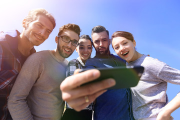 Canvas Print - group of young people taking a selfie.