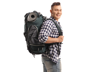 Canvas Print - Tourist with a backpack looking at the camera and smiling