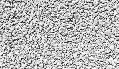 White rough stone wall for designers background texture, relief concrete surface