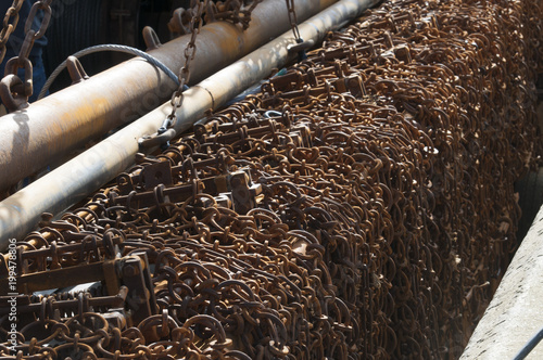 Rusty Chains Used For Raking The Sea Bed To Disturb Flatfish Hanging Over The Edge Of A Fishing Trawler Boat Buy This Stock Photo And Explore Similar Images At Adobe Stock