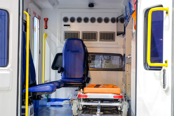 Wall Mural - Inside an ambulance with medical equipment for helping patients before delivery to the hospital.
