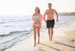 © Africa Studio - Attractive young couple on beach