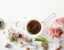 Cooking Meat Marinade On Kitchen White Table