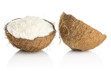 Two coconut halves with shavings isolated on white background brown fibrous shell with milk meat.