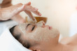 Young asian women treatment with facial mask in spa beauty salon.