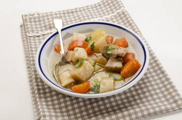 Wall Mural - homemade irish stew in a deep dish with a blue border