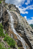 Fototapeta  - Waterfall on the rock. Named - Shirlak - Girl's tears . Altai, Siberia, Russia.