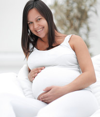 Wall Mural - portrait of a happy pregnant woman.