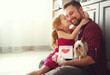 © JenkoAtaman - Father's day. Happy family daughter giving dad greeting card .