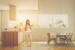 © ImageFlow - Woman in a luxury kitchen interior