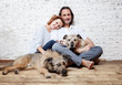 A happy married couple with their dogs, a seed portrait, love, care, friendship, devotion