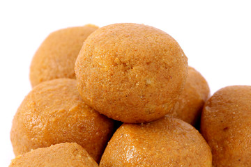 Wall Mural - Besan Laddoo - Roasted gram flour mixed with Desi Ghee and sugar to make tasty and round shape sweet Laddu. selective focus