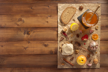 Wall Mural - glass jar of honey on wood