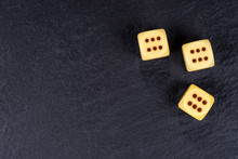 Three Dices On Black Background. Six Side Dices With Brown Dots