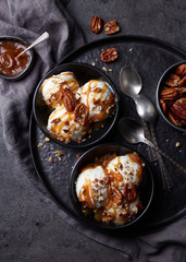 Wall Mural - Vanilla ice cream with caramel sauce and pecan nuts