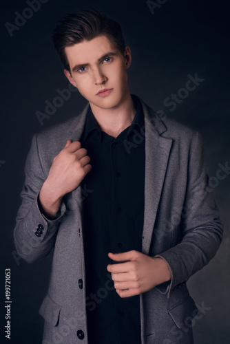 Young Handsome Man In Coat Portrait Of Fashionable Well Dressed