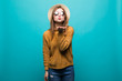 © dianagrytsku - Young fashionable attractive hipster girl in sunglasses and straw hat sends air kiss to camera. Nice playful and happy woman with red lips on green background with copy space.