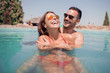 © ivanko80 - Couple having fun in swimming pool