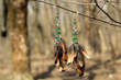 earrings of handmade dream catcher with feathers threads and beads rope hanging
