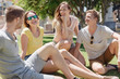 © contrastwerkstatt - Group of young friends chatting in an urban park