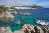 Fototapeta Do akwarium - Spain Mediterranean coast with rocks and the village Calella de Palafrugell in background, Costa Brava, Catalonia, Baix Emporda