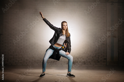 Horizontal Photo Of Blond Girl With Long Hair Standing On Dance