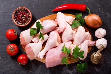 fresh chicken meat on dark board