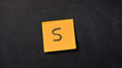 © stryjek - Sticky note with letter 'S' on the blackboard