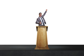 Wall Mural - Man businessman making speech at rostrum in business concept