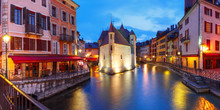 Panorama Wit The Palais De L'Isle And Thiou River During Morning Blue Hour In Old City Of Annecy, Venice Of The Alps, France
