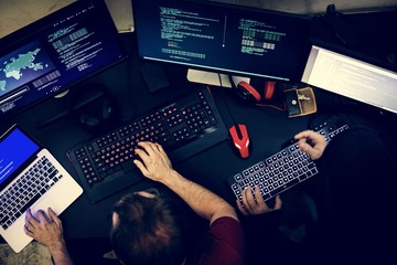 Wall Mural - couple of people working on computer codes programming